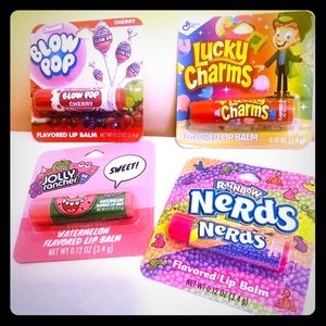 Set of 4 candy lip balms! Smells so good, too cute